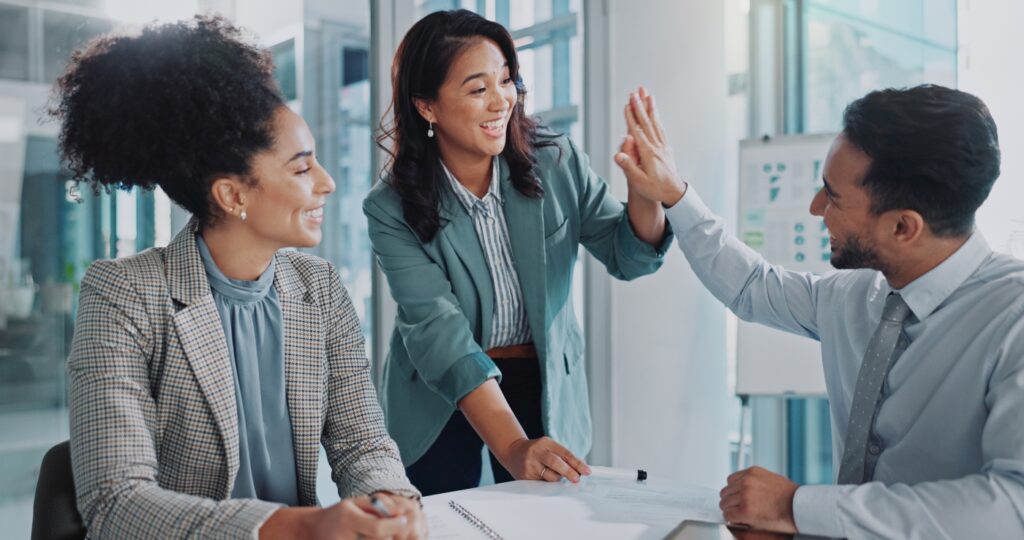 business-people-meeting-and-high-five-for-successful-results